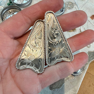 Silver western engraved pieces.